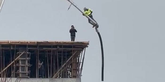 İnşaat çalışmasında çok tehlikeli anlar! Yerden 20 metre yüksekte beton pompasına çıktı, ölüme meydan okudu